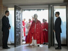 Pope Francis walks through the Holy Door at Rome’s Rebibbia Prison Complex on the feast of St. Stephen, Thursday, Dec. 26, 2024.