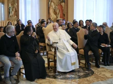 Pope Francis meets with members of the Filipino community at the Vatican's Consistory Hall on Monday, Dec. 16, 2024.