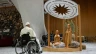 Pope Francis stops for a brief prayer in front of the Bethlehem Nativity in the Vatican's Paul VI Hall during its presentation and a meeting with some of the people involved in its creation on Dec. 7, 2024.