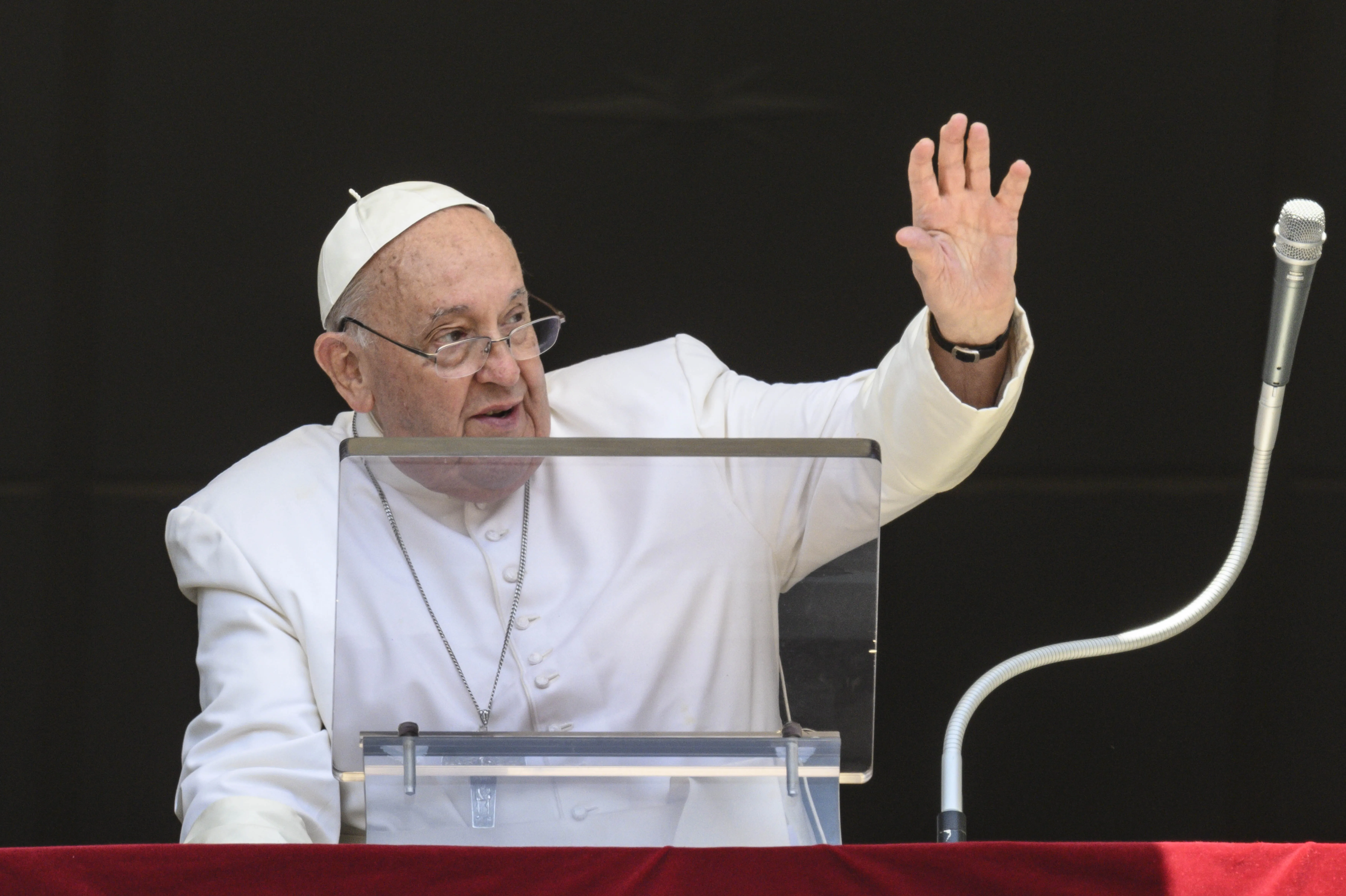 Pope Francis waves to crowds before his noon Angelus address during a hot day in Rome on July 14, 2024.?w=200&h=150