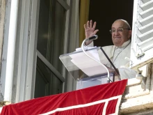 Pope Francis waves to pilgrims gathered in St. Peter's Square for his Angelus reflection on Oct. 6, 2024.