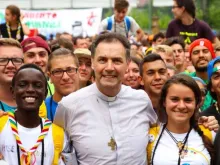 The 10th successor of St. Don Bosco to the Salesians, Cardinal Ángel Fernández Artime, along with young people from the Salesians. |