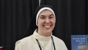 Sister Tonia of the Heart of Jesus Borsellino at the booth for the Mercedarian Sisters of the Blessed Sacrament at SEEK25 in Salt Lake City on Jan. 3, 2025.