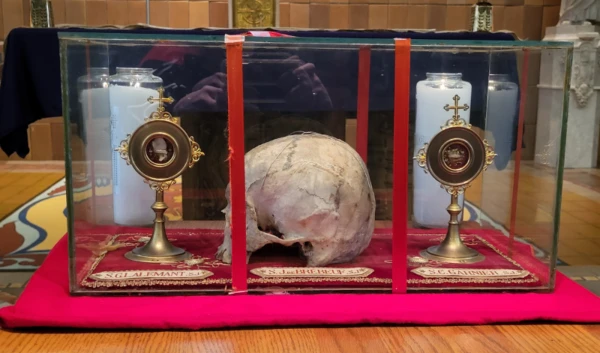 The major relic of St. Jean de Brebeuf, his skull, flanked by major relics of St. Gabriel Lalemant (left) and St. Charles Garnier (right), both bone fragments. Credit: The Shrine of the Canadian Martyrs