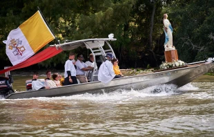 The Fête-Dieu du Teche, an annual procession in the bayou organized by the Community of Jesus Crucified in 2023. This boat carries a state of the Assumption, following a boat carrying the Blessed Sacrament. Credit: Photo courtesy of the CJC