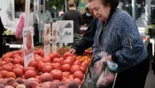 A woman shops for fresh produce in a farmers market in Manhattan on Sept. 29, 2021, in New York City.