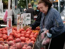 A woman shops for fresh produce in a farmers market in Manhattan on Sept. 29, 2021, in New York City.