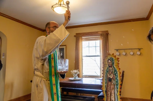 Father Jonathan St. André, TOR, blesses the dining room of Guadalupe House, a new home for pregnant students at Franciscan University of Steubenville in eastern Ohio. Credit: Ben Glaser/Franciscan University