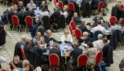 Delegates at the 2024 Synod on Synodality participate in roundtable meetings on Oct. 10, 2024, in the Paul VI Hall at the Vatican.