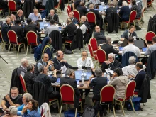 Delegates at the 2024 Synod on Synodality participate in roundtable meetings on Oct. 10, 2024, in the Paul VI Hall at the Vatican.