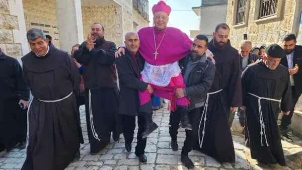 Bishop Hanna Jallouf is warmly received in his hometown and parish (Al-Qaniya, Idlib countryside, Syria). Credit: CTS