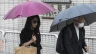 Jimmy Lai’s wife, Teresa (left), and retired Chinese Cardinal Joseph Zen Ze-Kiun arrive at the West Kowloon Magistrates’ Courts to attend Hong Kong activist publisher Lai’s national security trial in Hong Kong on Wednesday, Nov. 20, 2024.