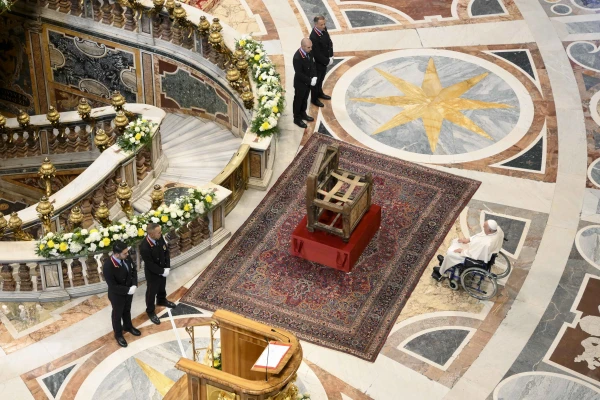 Pope Francis venerates the Chair of St. Peter at the end of the closing Mass of the Synod on Synodality on Oct. 27, 2024, in Rome. Credit: Vatican Media