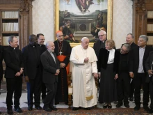 Pope Francis speaks to members of the International Theological Commission at the Vatican on Thursday, Nov. 28, 2024.