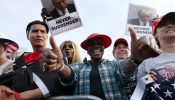 Supporters of former president Donald Trump watch as he holds a rally in the historically Democratic district of the South Bronx on May 23, 2024, in New York City.