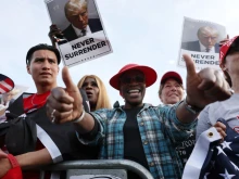 Supporters of former president Donald Trump watch as he holds a rally in the historically Democratic district of the South Bronx on May 23, 2024, in New York City.