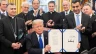 President Donald J. Trump is joined by legislators and Archbishop Bashar Warda of Erbil-Kurdistan, Iraq, left, as he signs H.R. 390, the Iraq and Syria Genocide Relief and Accountability Act of 2018 on Dec. 11, 2018, in the Oval Office of the White House.