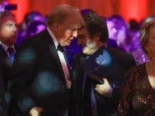 Argentine President Javier Milei walks past President-elect Donald Trump as they attend the America First Policy Institute Gala held at Mar-a-Lago on Nov. 14, 2024, in Palm Beach, Florida.