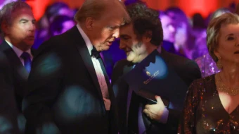 Argentine President Javier Milei walks past President-elect Donald Trump as they attend the America First Policy Institute Gala held at Mar-a-Lago on Nov. 14, 2024, in Palm Beach, Florida.