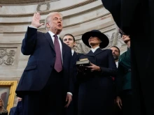 Donald Trump is sworn in as the 47th president of the United States by Chief Justice John Roberts as Melania Trump holds the Bible during the 60th presidential inauguration in the rotunda of the U.S. Capitol in Washington, D.C., on Monday, Jan. 20, 2025.