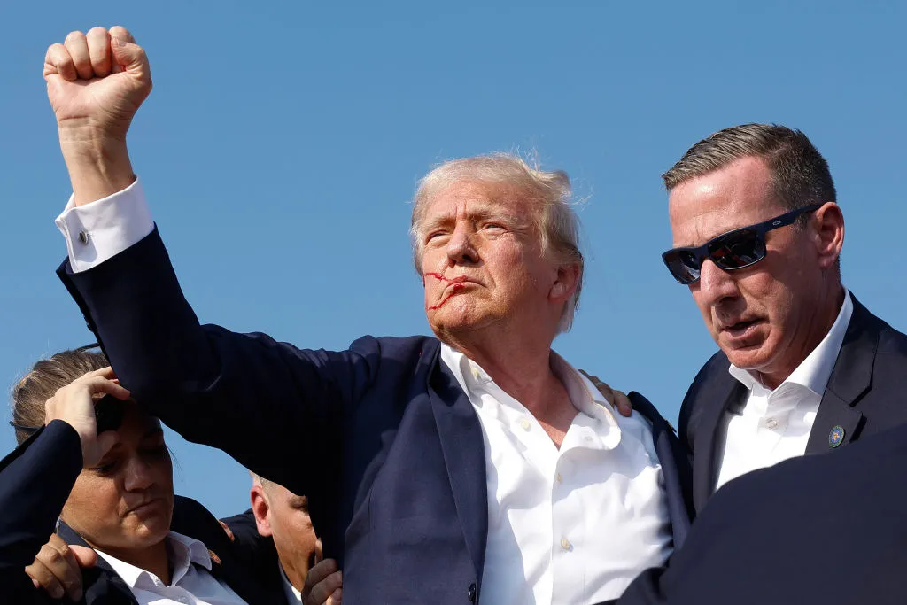 Republican presidential candidate former President Donald Trump pumps his fist as he is rushed offstage during a rally on July 13, 2024, in Butler, Pennsylvania.?w=200&h=150