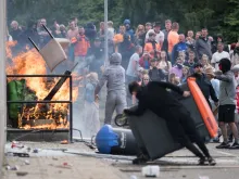 Protesters attempt to enter the Holiday Inn Express Hotel, which is housing asylum seekers, on Aug. 4, 2024, in Rotherham, United Kingdom.