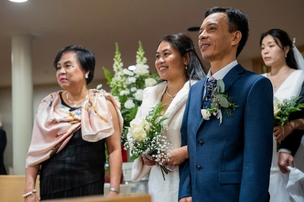 Eddelyn and Mario John prepare to walk down the aisle with 18 other couples at the Marriage Mass at St. Mary’s Church in Vancouver on Oct. 19, 2024. Credit: Nicholas Elbers/The B.C. Catholic