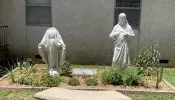 A vandalized statue of Mary, the Mother of God, at St. Leo Parish in Hartford, Arkansas, July 2024.