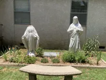 A vandalized statue of Mary, the Mother of God, at St. Leo Parish in Hartford, Arkansas, July 2024.