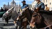 Men ride mules in Via della Conciliazione as they take part in the feast of San Antonio Abate (St. Anthony the Abbot), the patron saint and protector of animals, in Piazza Pio XII in front of the Vatican, in Rome on Jan. 17, 2025. Italian farmers and member of the Coldiretti farmers association gathered in the Vatican where families and animals received a benediction from Cardinal Mauro Gambetti.