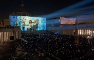 The facade of St. Peter’s Basilica was illuminated on Sunday, Oct. 2, 2022, with 3-D projection mapping of Renaissance art from the Vatican Museums in a new light display titled “Follow Me: The Life of St. Peter.” The display will be projected on the facade of St. Peter’s Basilica every 15 minutes between 9 p.m. and 11 p.m. each night through Oct. 16, 2022. Vatican Media livestream screenshot