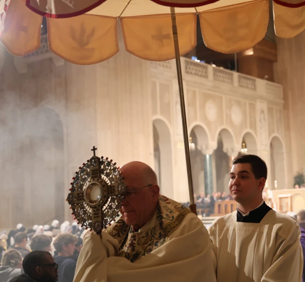 Kansas City Archbishop Joseph Fred Naumann processes down the aisles of the upper church of the basilica with the Blessed Sacrament and held adoration. Credit: Photo courtesy of the Basilica of the National Shrine of the Immaculate Conception.