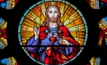 The Sacred Heart is at the center of a rose window in Santa Ifigênia Church, São Paulo, Brazil.