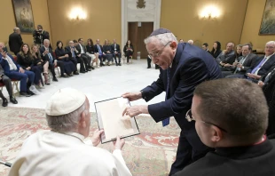 Pope Francis receives a facsimile of a 1919 letter by Adolf Hitler for the Vatican archives during an audience with a delegation of Simon Wiesenthal Center at the Vatican, June 22, 2022. Vatican Media