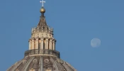 The moon was visible over St. Peter's Basilica, Vatican, on the morning of Oct. 12. 2022.