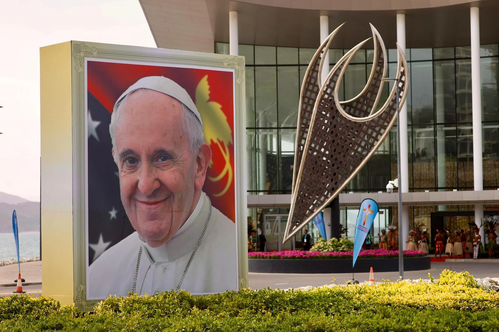 A smiling Pope Francis is depicted on a sign outside the APEC Haus in Port Moresby, Papua New Guinea, on the occasion of the pontiff's visit, Sept. 7, 2024.?w=200&h=150