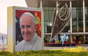 A smiling Pope Francis is depicted on a sign outside the APEC Haus in Port Moresby, Papua New Guinea, on the occasion of the pontiff's visit, Sept. 7, 2024. Credit: Daniel Ibáñez/CNA