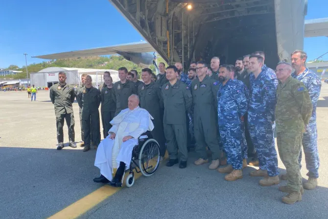 Pope Francis boarding a flight of the Royal Australian Air Force from Port Moresby to the remote town of Vanimo, Papua New