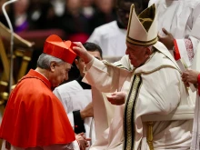 Pope Francis places the red biretta on Cardinal Domenico Battaglia, archbishop of Naples, during the consistory for the creation of 21 new cardinals in St. Peter's Basilica, Dec. 7, 2024.