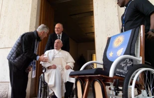 Father Enrique “Kike” Figaredo on Oct. 23, 2024, presents Pope Francis with a wheelchair made by land mine survivors in Cambodia. Credit: Courtesy of Father Kike Figaredo