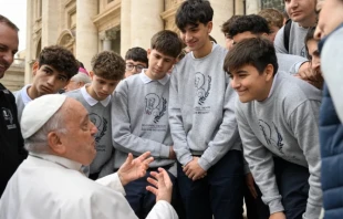 Pope Francis speaks with young men during a general audience. Credit: Vatican Media