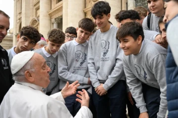 Young men talk with Pope Francis